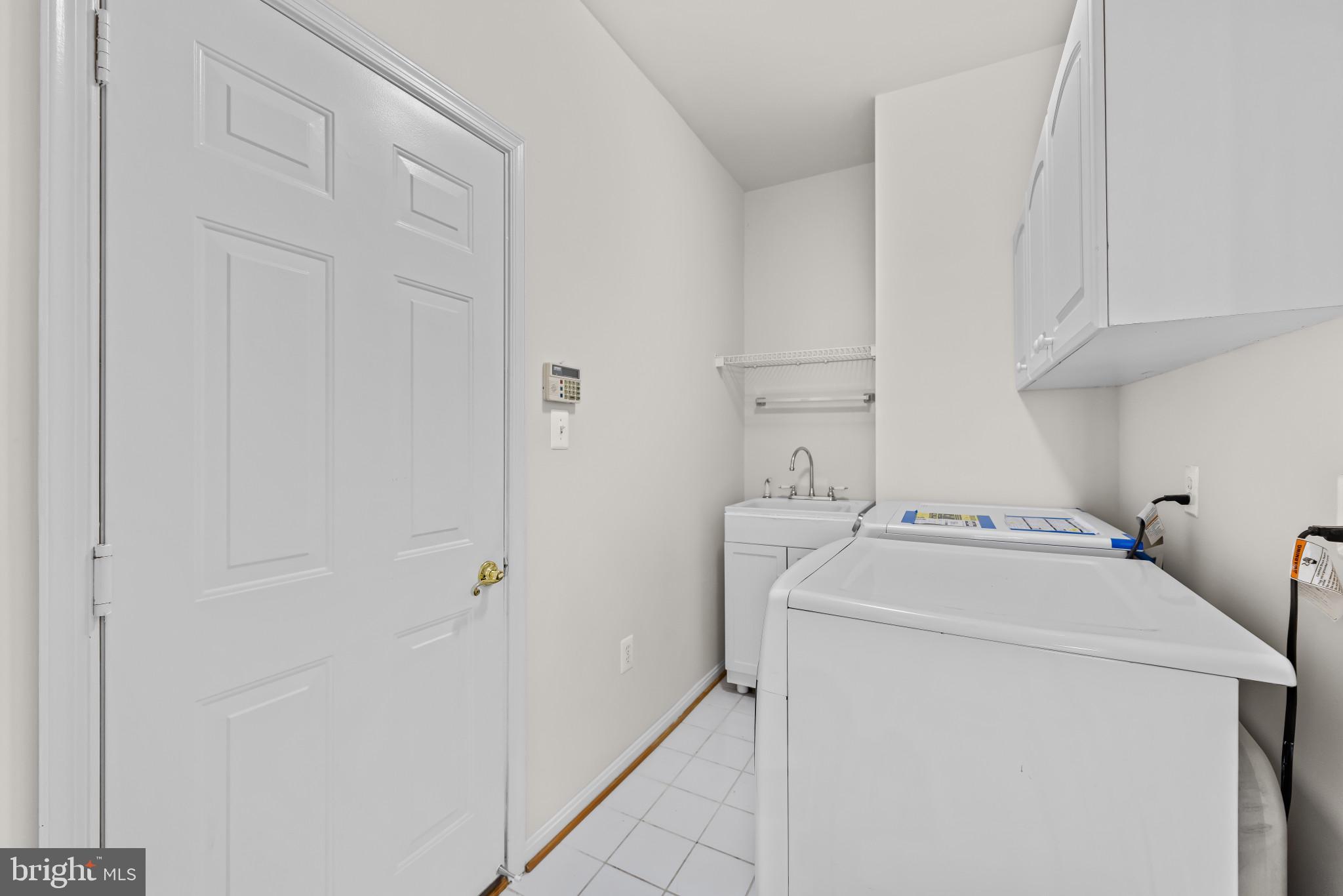 42920 Cattail Meadows Place Broadlands, VA 20148 - Photo 20 of 55 a utility room with dryer and washer