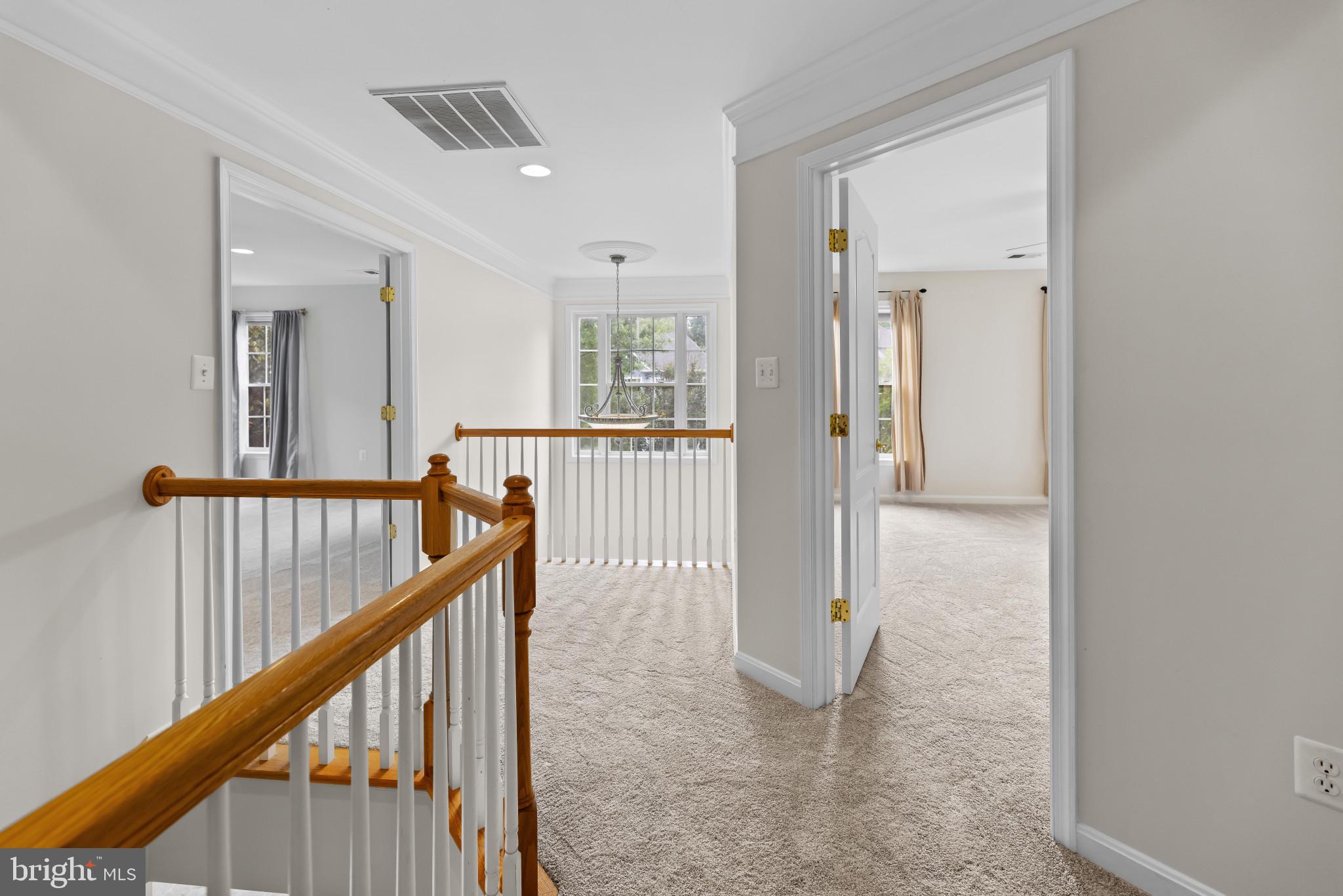 42920 Cattail Meadows Place Broadlands, VA 20148 - Photo 21 of 55 a view of a hallway with wooden floor and windows