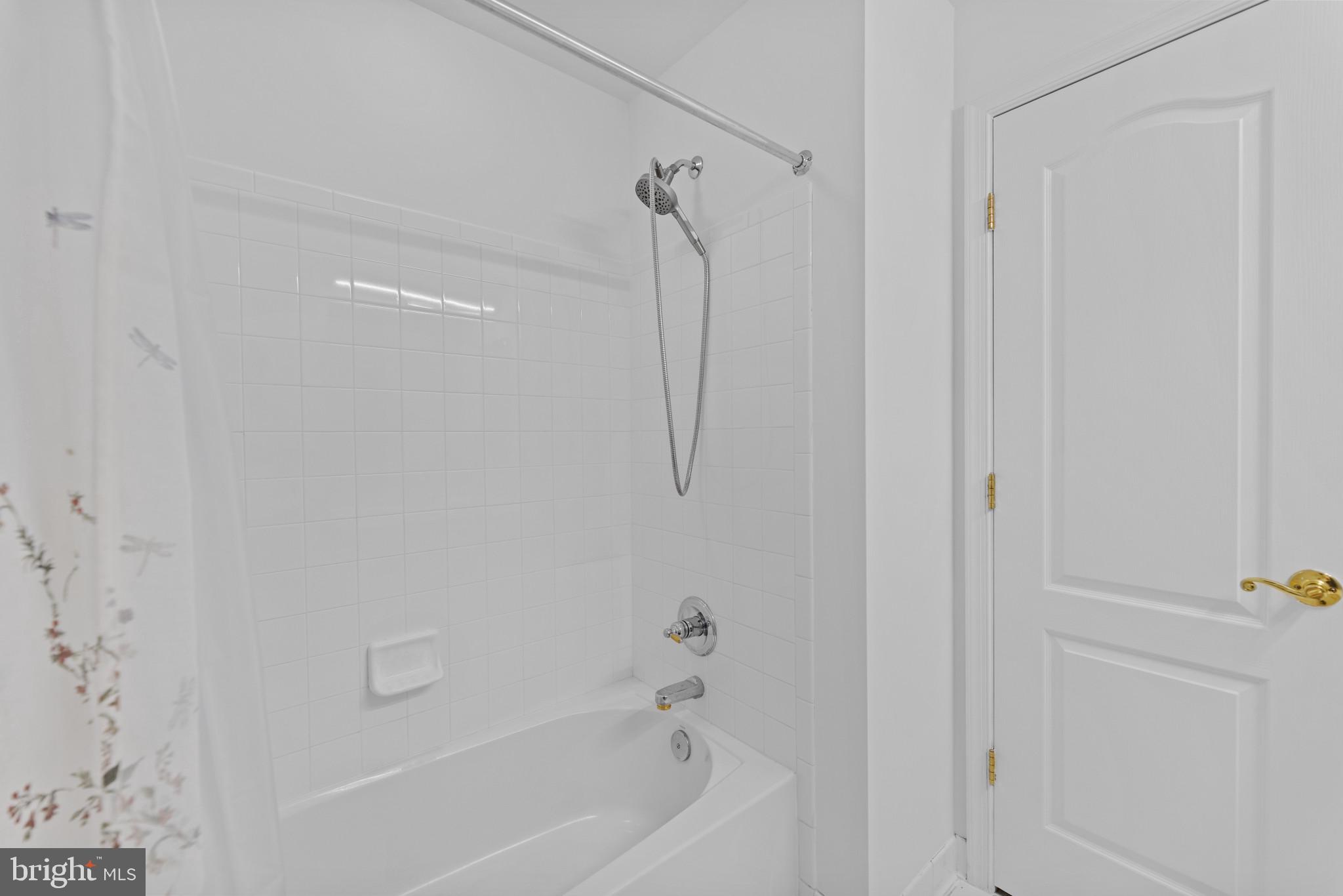 42920 Cattail Meadows Place Broadlands, VA 20148 - Photo 44 of 55 a bathroom with a bathtub and shower