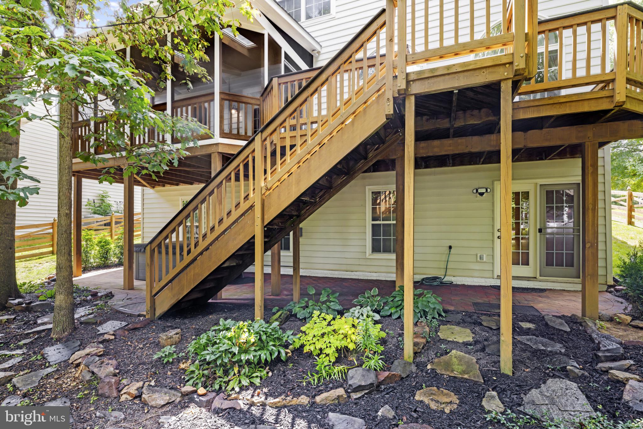 42920 Cattail Meadows Place Broadlands, VA 20148 - Photo 50 of 55 a view of a house with wooden stairs and a bench