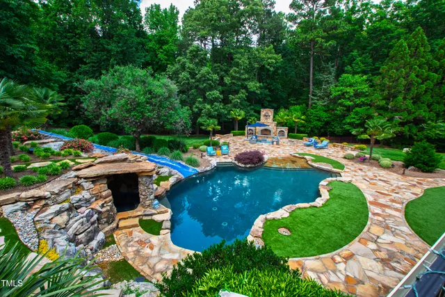 a view of swimming pool with a patio