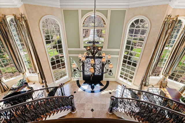 a spacious bathroom with a tub sink and mirror