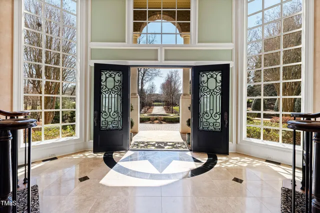 a view of a room with wooden floor and windows