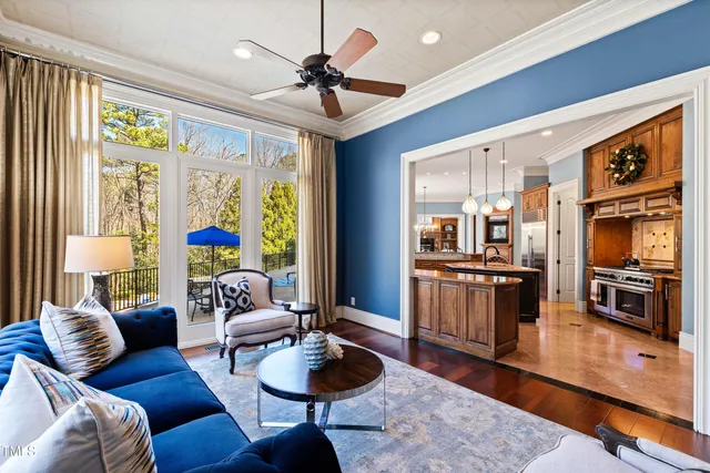 a view of a balcony with furniture and chandelier