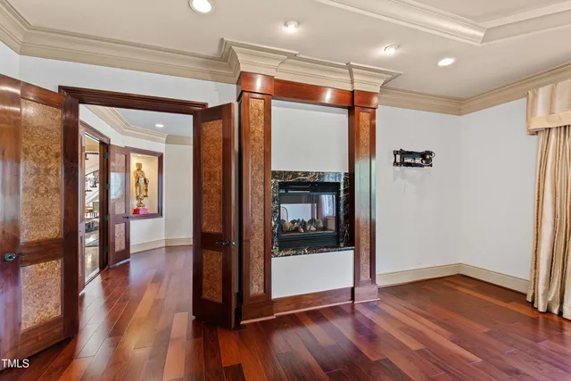 a view of house with garden and car parked
