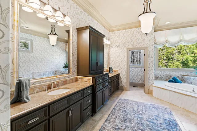 an aerial view of a house with a swimming pool and garden