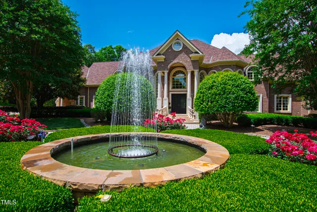 a view of a lake with a yard swimming pool and outdoor seating