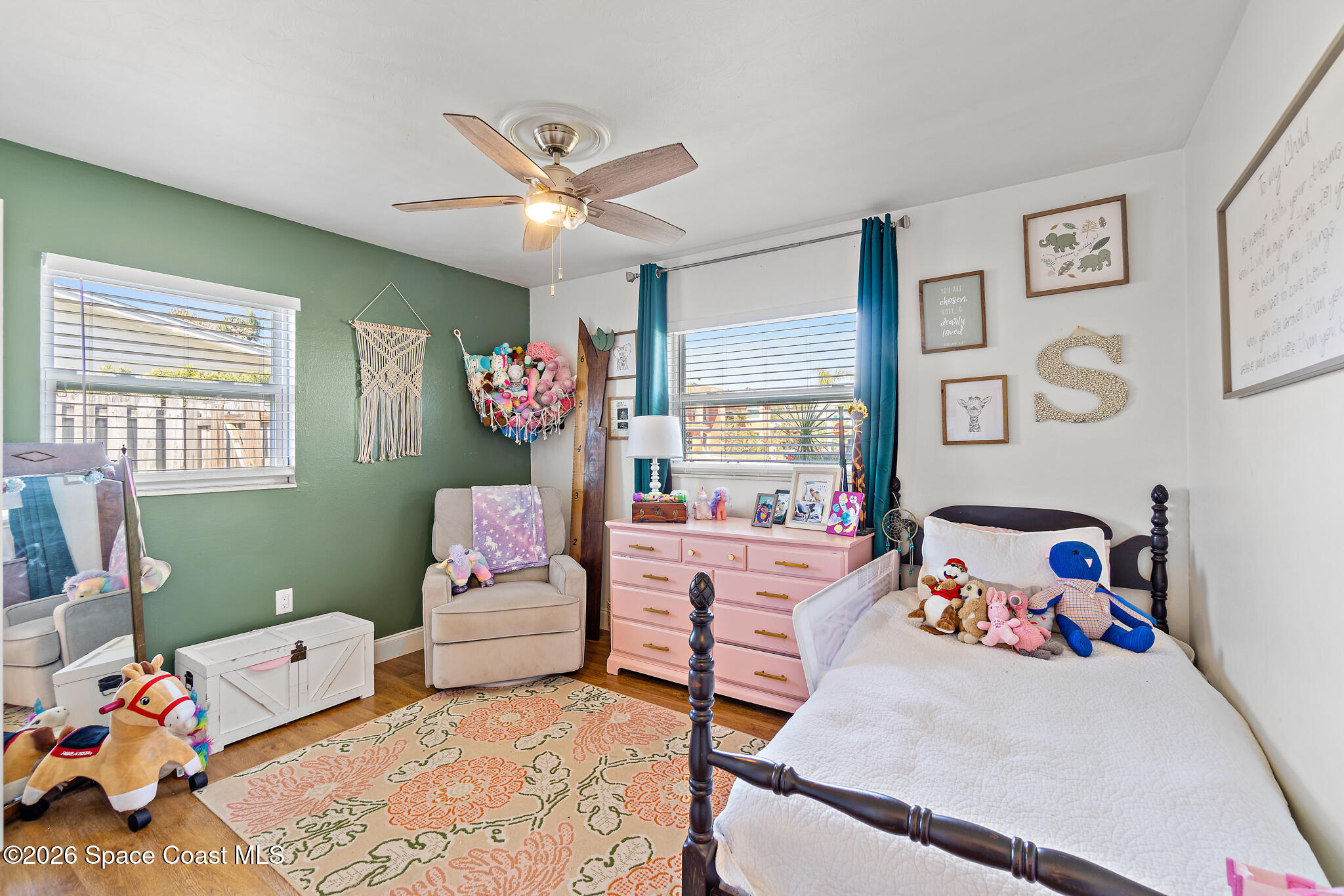 740 Java Road Cocoa Beach, FL 32931 - Photo 11 of 40 a bed room with furniture and a window