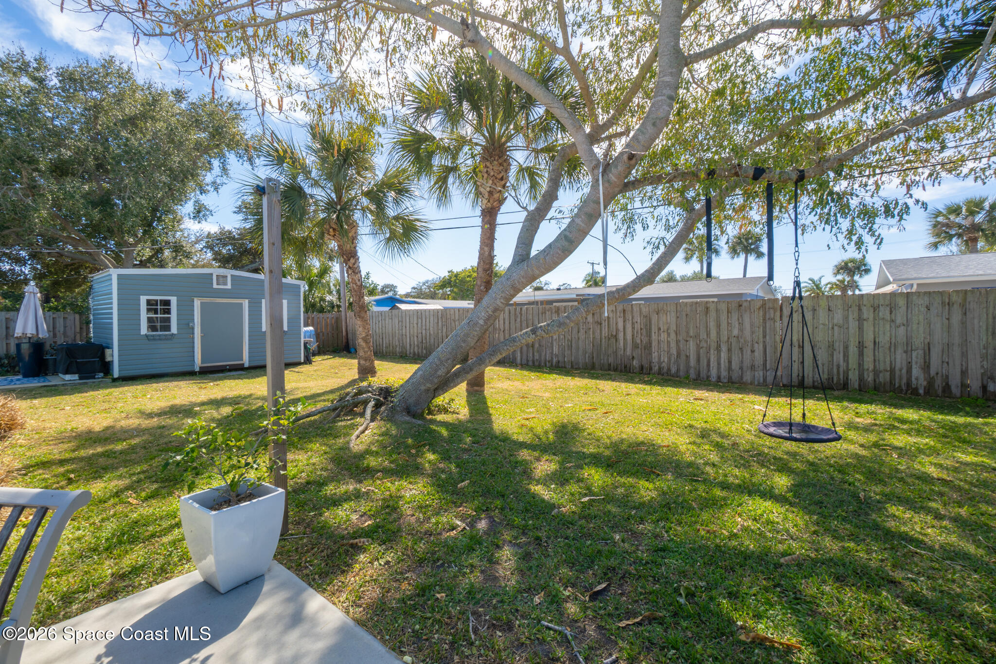 740 Java Road Cocoa Beach, FL 32931 - Photo 17 of 40 a view of a backyard with a small garden