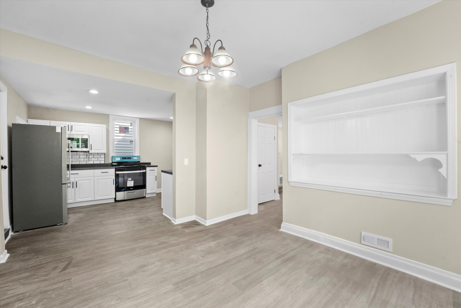 7224 South Union Avenue Chicago, IL 60621 - Photo 13 of 43 a view of a kitchen with a refrigerator and a stove top oven
