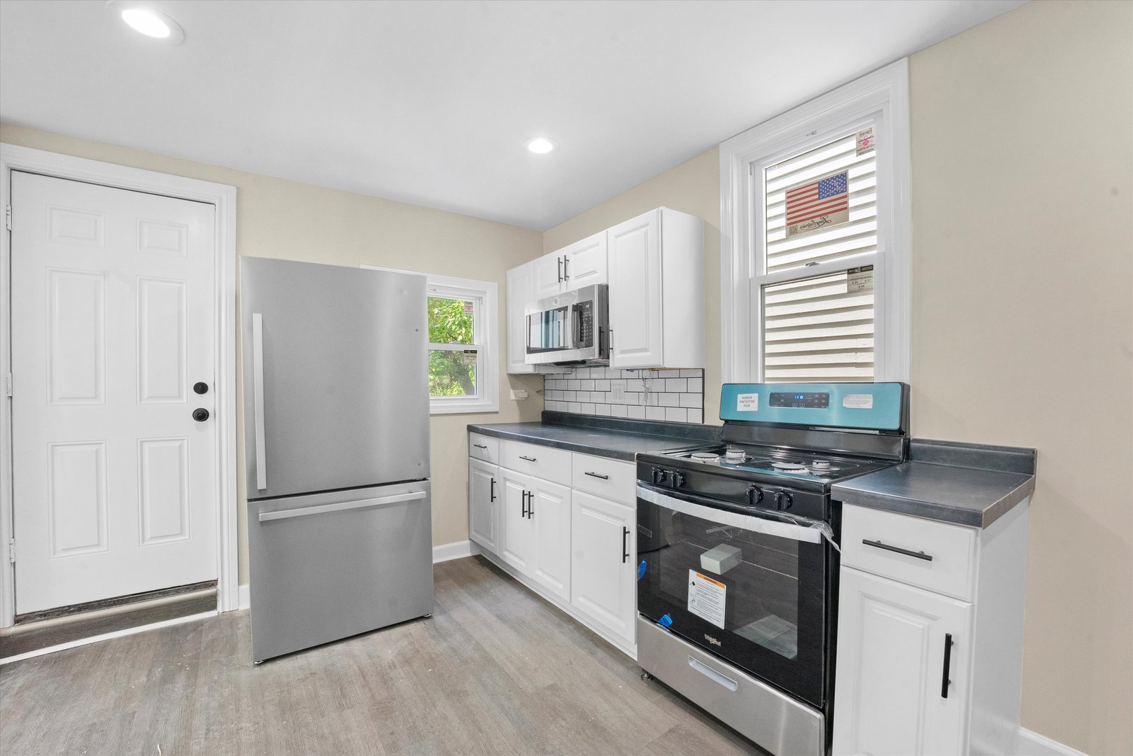 7224 South Union Avenue Chicago, IL 60621 - Photo 15 of 43 a kitchen with stainless steel appliances granite countertop a stove a refrigerator and a sink