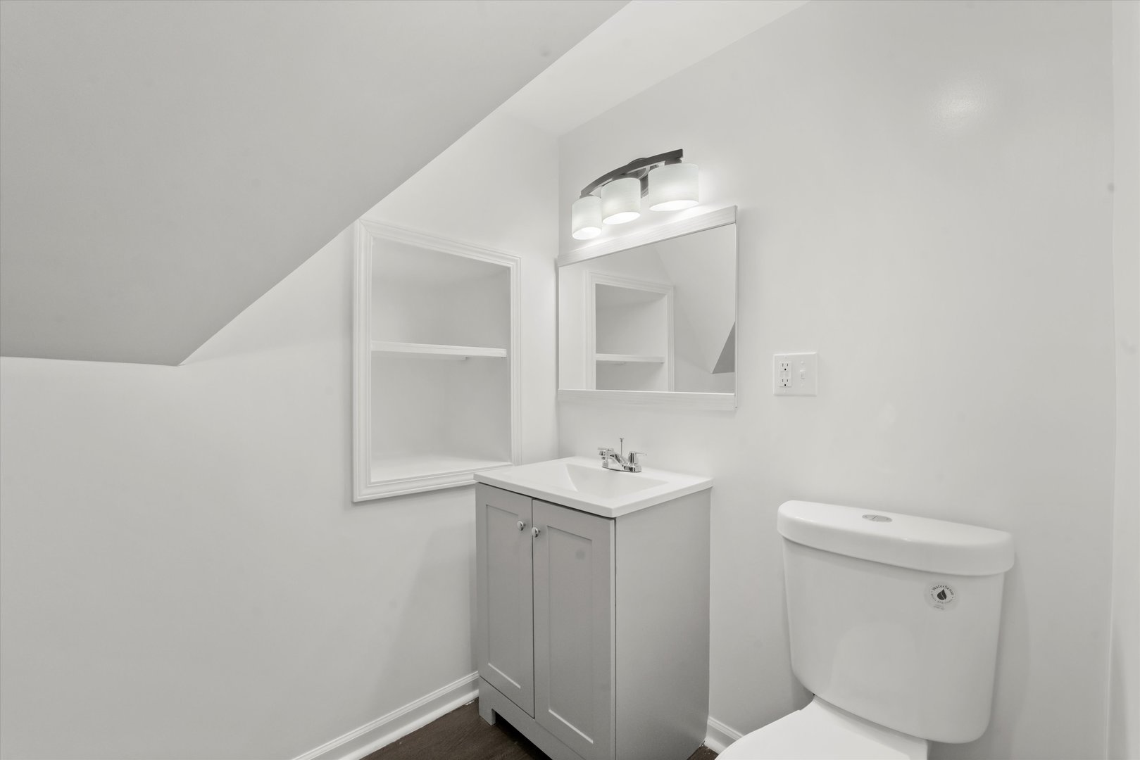 7224 South Union Avenue Chicago, IL 60621 - Photo 18 of 43 a bathroom with a toilet a sink and mirror