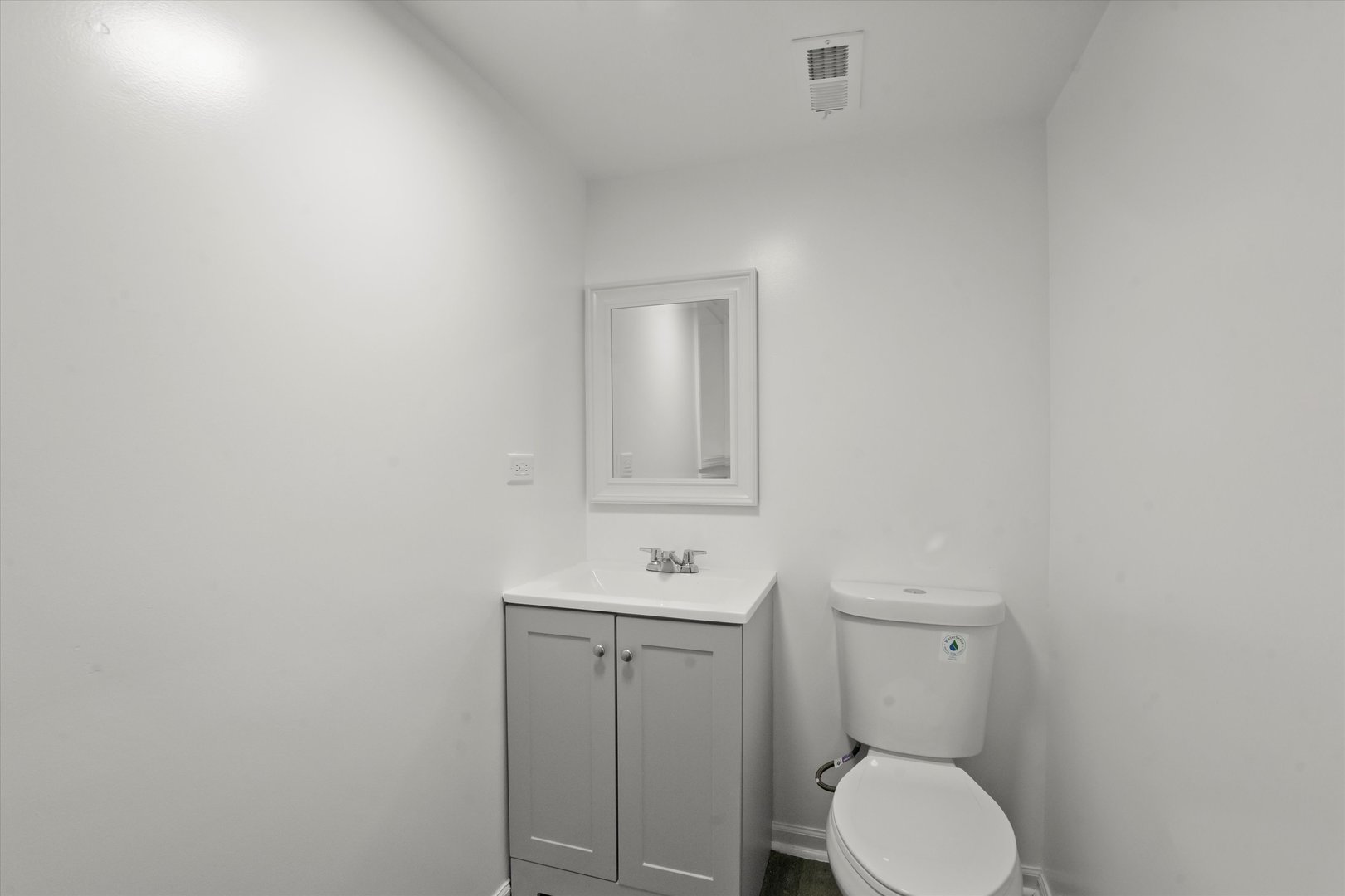 7224 South Union Avenue Chicago, IL 60621 - Photo 34 of 43 a bathroom with a toilet a sink and mirror