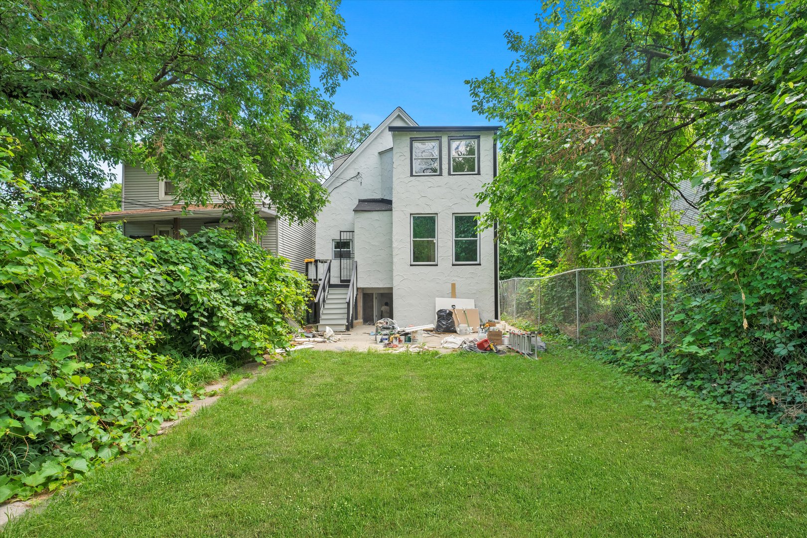 7224 South Union Avenue Chicago, IL 60621 - Photo 39 of 43 a view of a house with a yard and sitting area