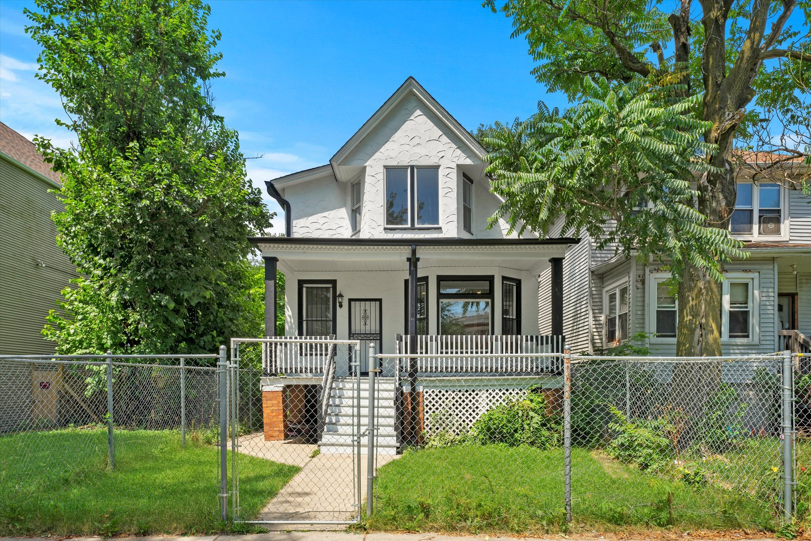 7224 South Union Avenue Chicago, IL 60621 - Photo 4 of 43 a front view of a house with a yard
