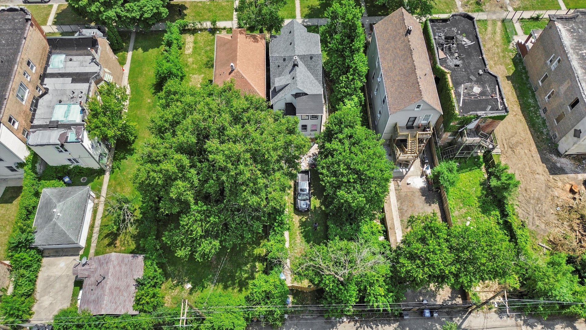 7224 South Union Avenue Chicago, IL 60621 - Photo 42 of 43 an aerial view of a house with outdoor space and trees all around