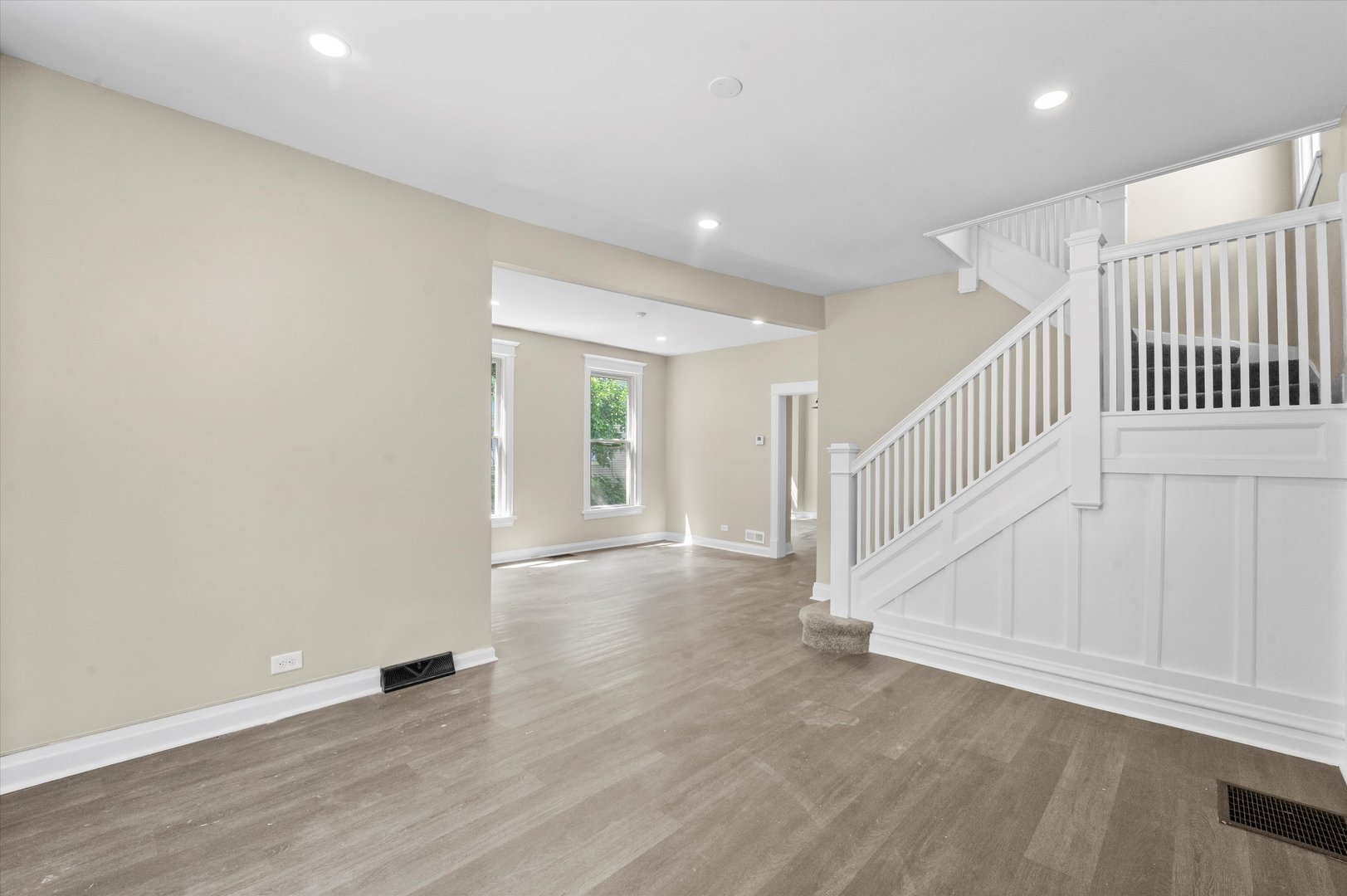 7224 South Union Avenue Chicago, IL 60621 - Photo 9 of 43 a view of an empty room with wooden floor and stairs