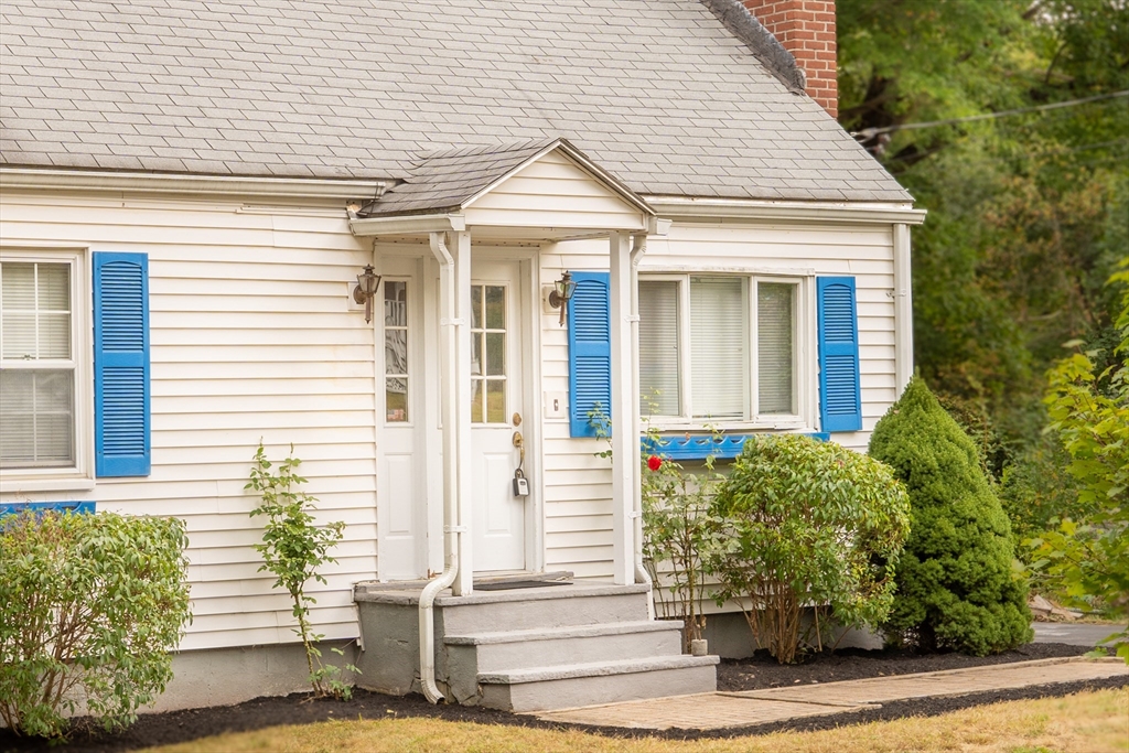 25 Adams Road Ashland, MA 01721 - Photo 4 of 34 a front view of a house with a yard