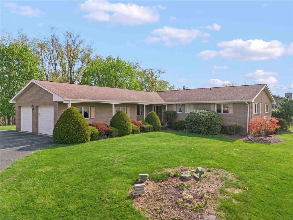254 Walnut Street Houston, PA 15342 - Photo 1 of 29 a front view of a house with garden