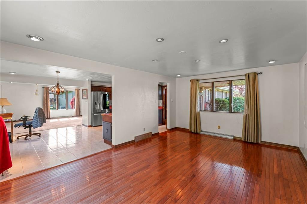 254 Walnut Street Houston, PA 15342 - Photo 14 of 29 a view of an empty room with wooden floor and a window