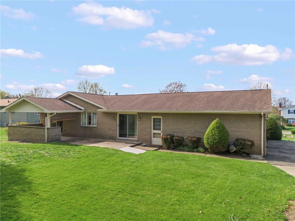 254 Walnut Street Houston, PA 15342 - Photo 25 of 29 a front view of a house with a garden and plants