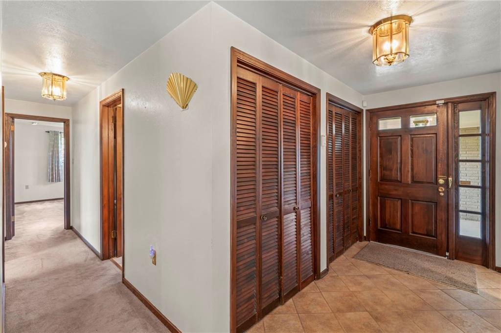 254 Walnut Street Houston, PA 15342 - Photo 6 of 29 a view of hallway with closet and a chandelier fan