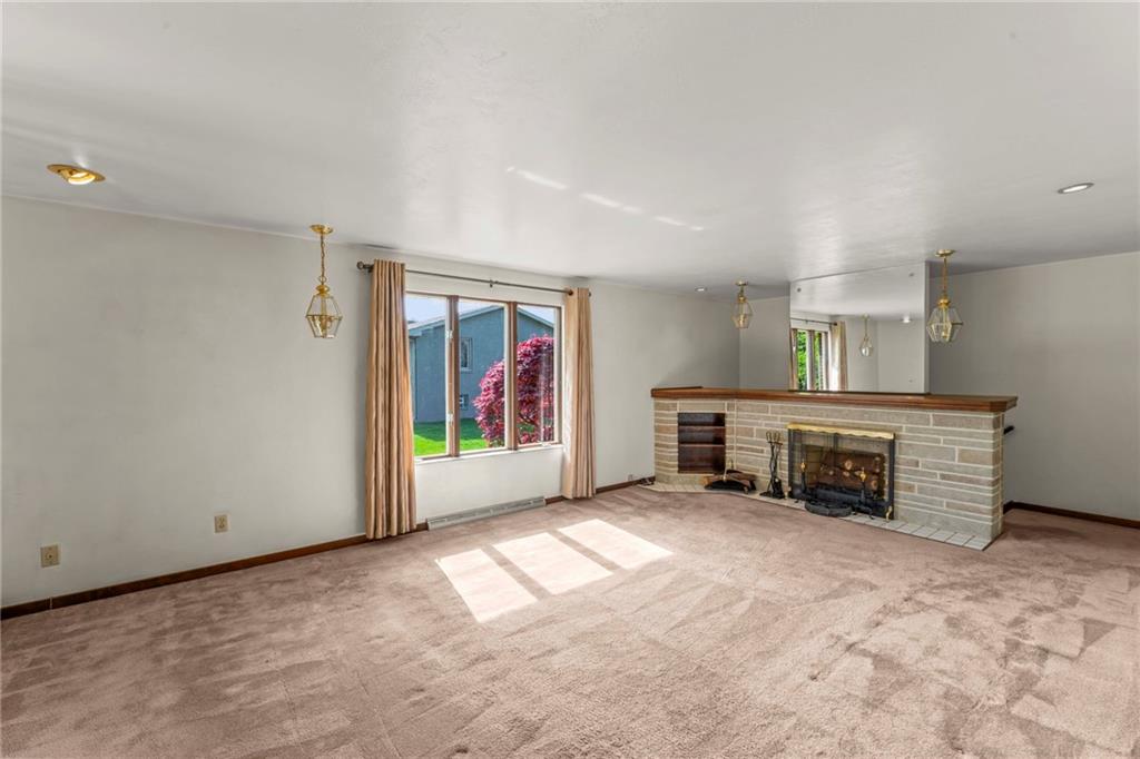 254 Walnut Street Houston, PA 15342 - Photo 7 of 29 an empty room with furniture and a fireplace