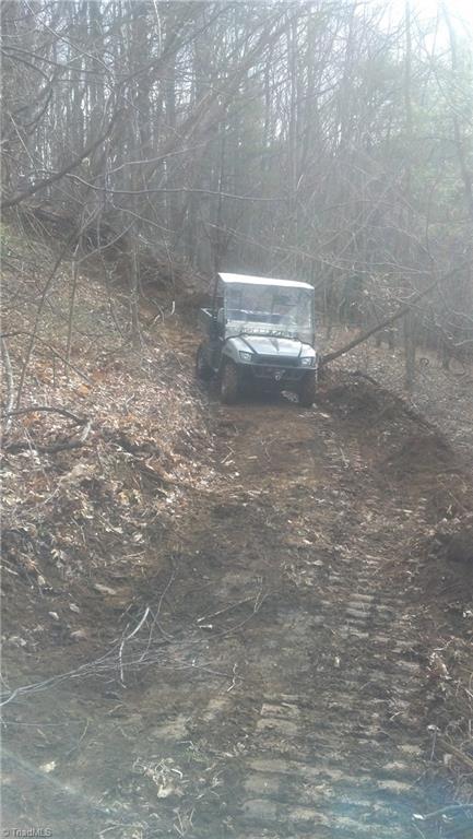 Off Lewis Road West Jefferson, NC 28694 - Photo 4 of 29 Grading access roads for easier viewing and exploring of this marvelous 252-acres!