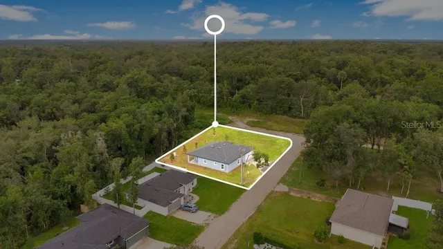 a picture of a bathroom with a white wall
