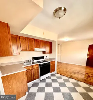 a kitchen with stainless steel appliances granite countertop a sink and a stove