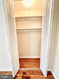 a view of a room with wooden floor and stairs