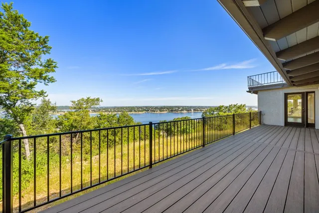 a view of balcony with wooden floor