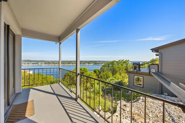 a view of balcony with furniture