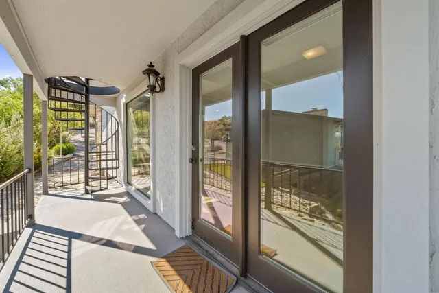 an aerial view of a house with a garden and lake view