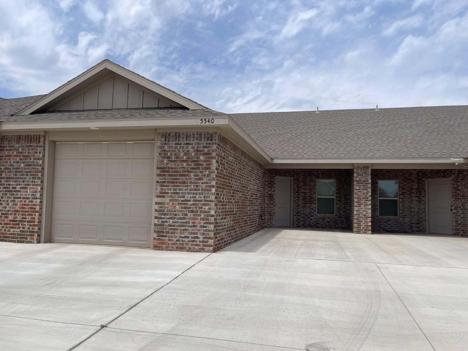 a front view of a house with a garage