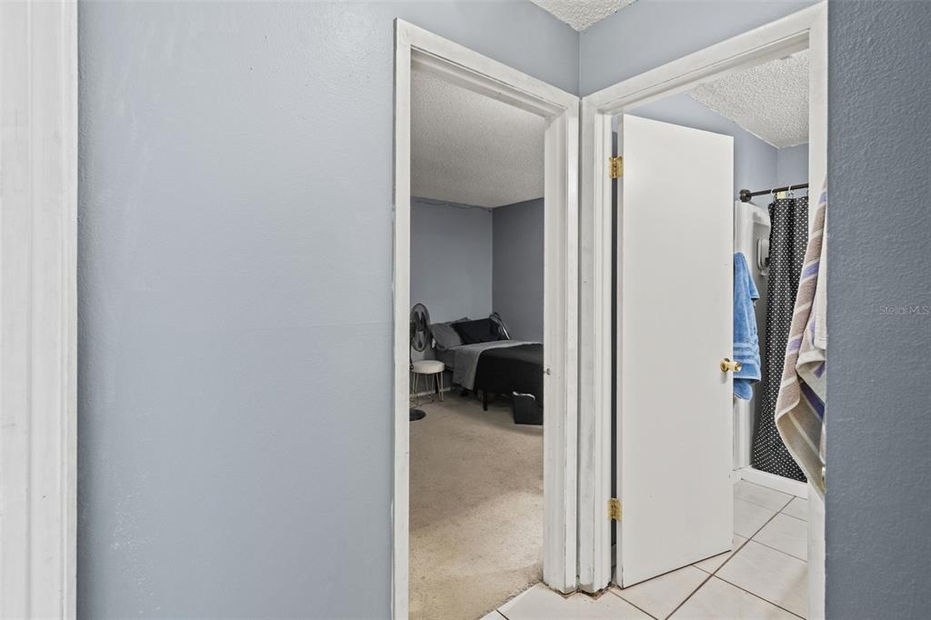 12989 Linden Drive Spring Hill, FL 34609 - Photo 20 of 28 a view of a hallway with closet and a bathroom