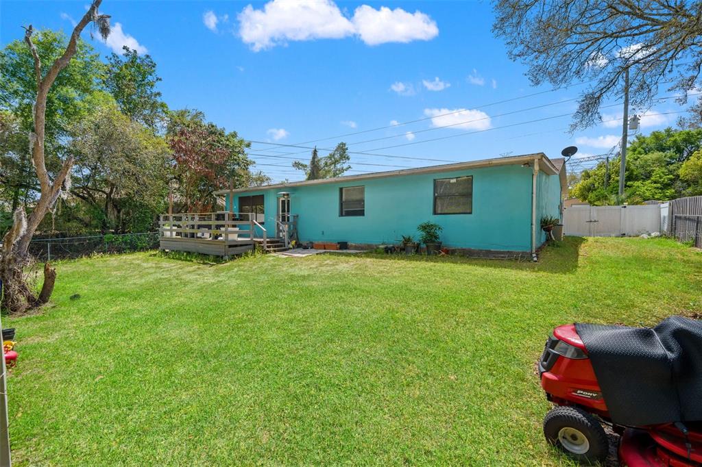 12989 Linden Drive Spring Hill, FL 34609 - Photo 25 of 28 a view of a chair and table in the garden