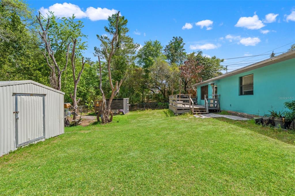 12989 Linden Drive Spring Hill, FL 34609 - Photo 28 of 28 a front view of a house with garden