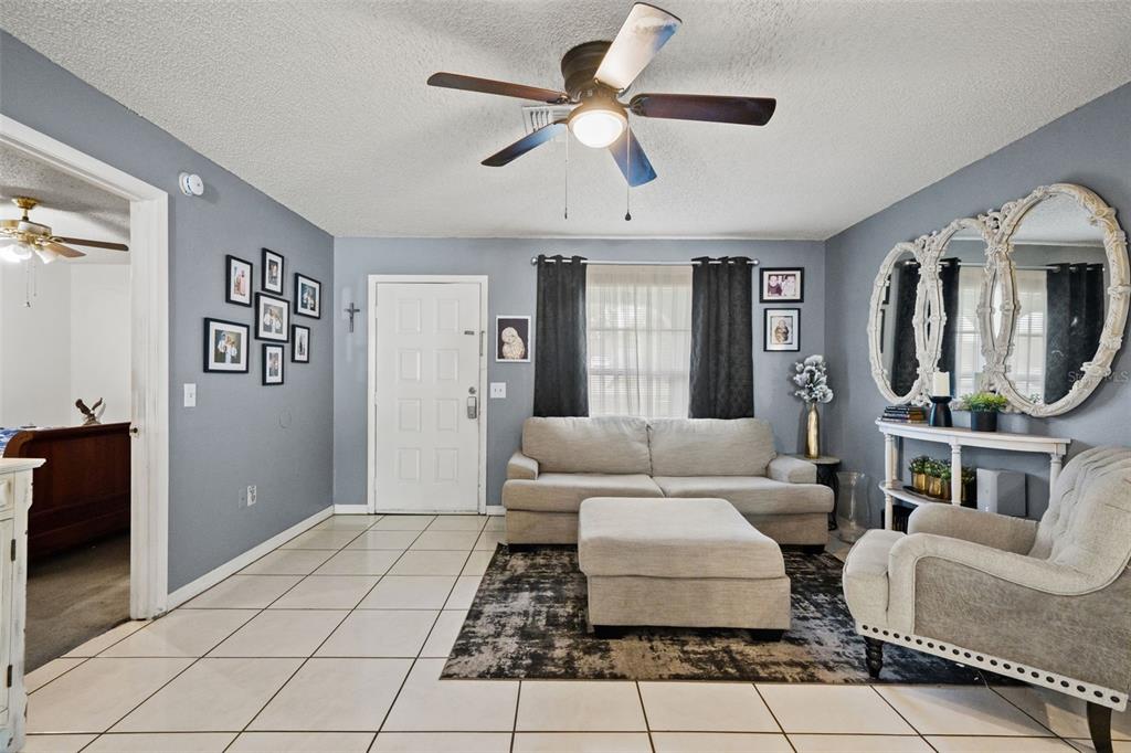 12989 Linden Drive Spring Hill, FL 34609 - Photo 10 of 28 a living room with furniture and a mirror