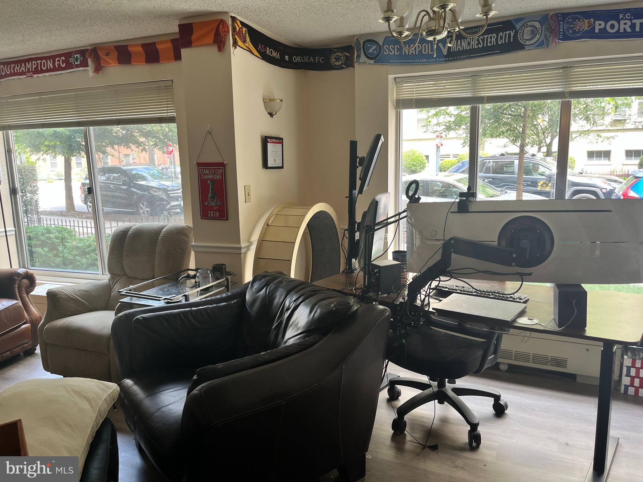 1239 Vermont Avenue Northwest, Unit 104 Washington, DC 20005 - Photo 11 of 30 a living room with furniture and a large window
