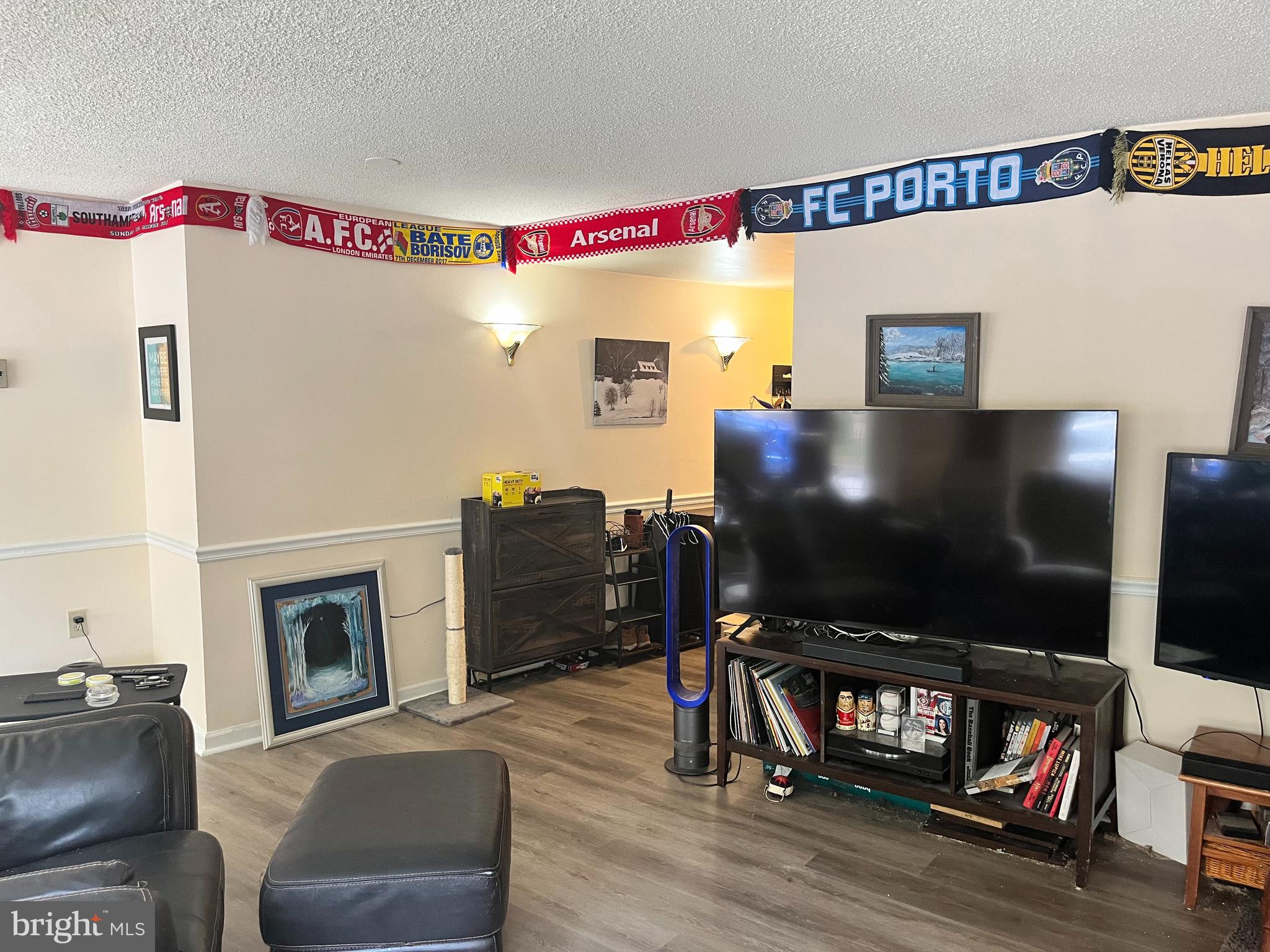 1239 Vermont Avenue Northwest, Unit 104 Washington, DC 20005 - Photo 13 of 30 a living room with furniture and a flat screen tv