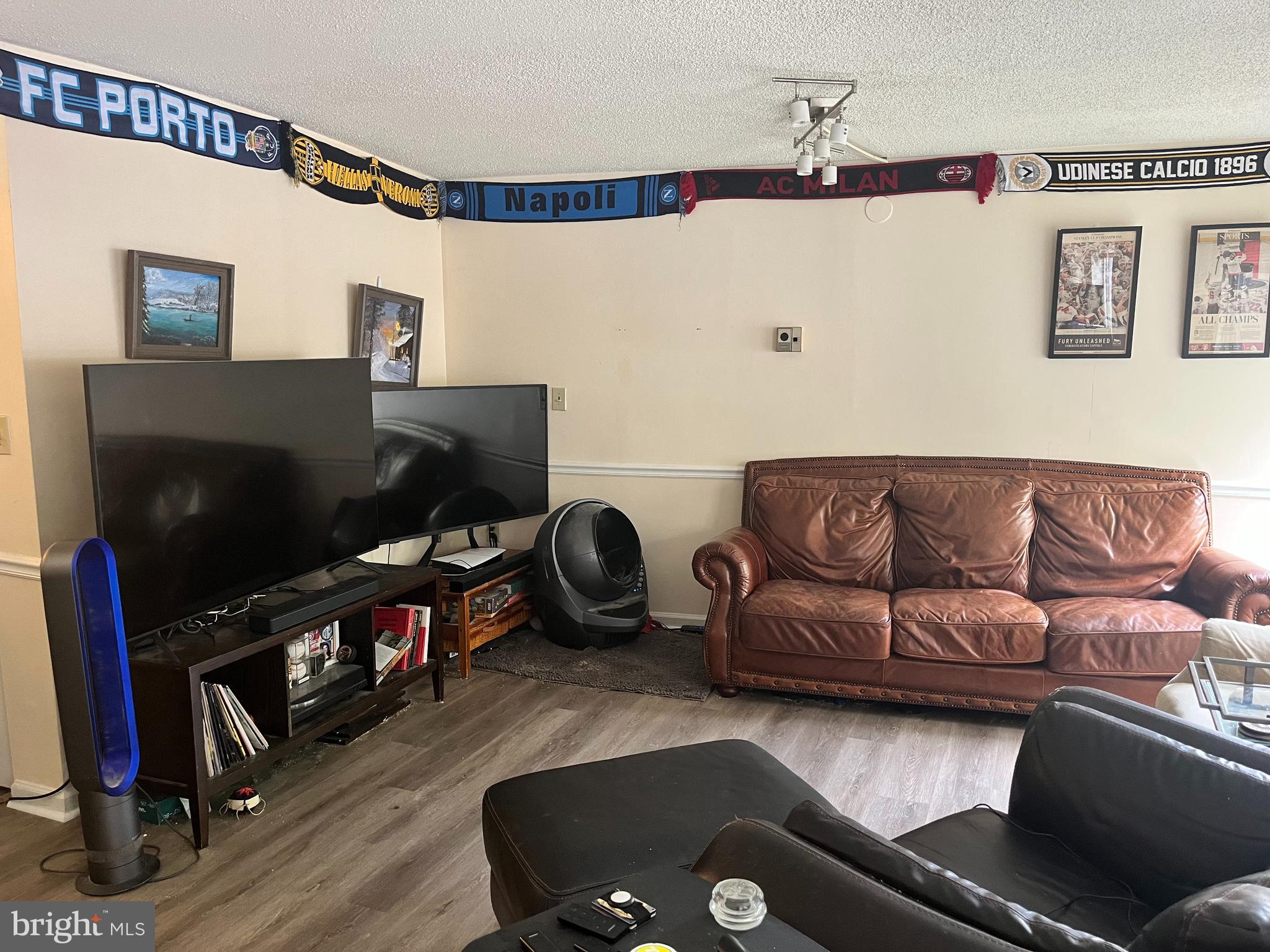 1239 Vermont Avenue Northwest, Unit 104 Washington, DC 20005 - Photo 14 of 30 a living room with furniture and a flat screen tv