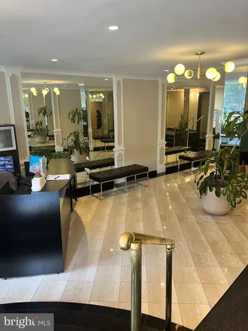 a view of a lobby with furniture and floor to ceiling window