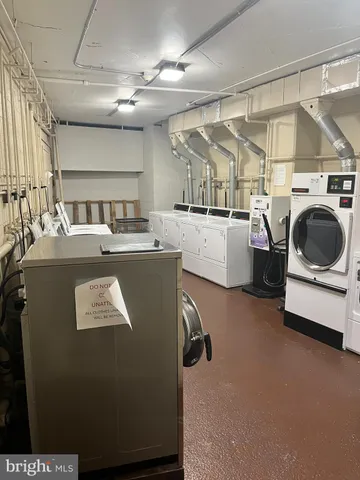 a view of a storage & utility room with washer and dryer