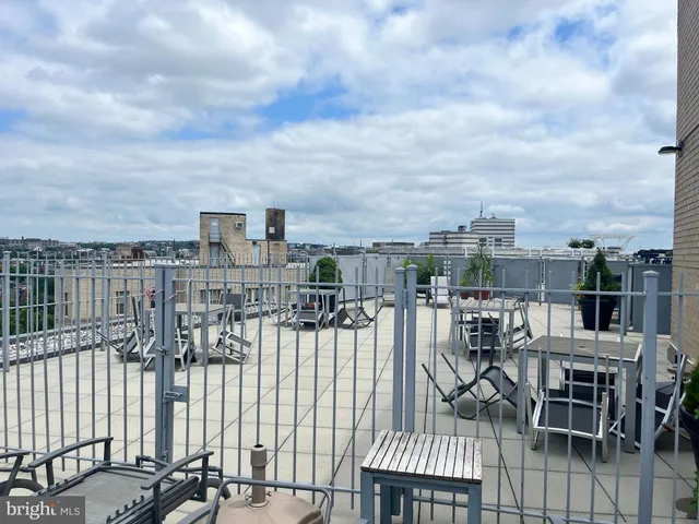 a view of a balcony with chairs