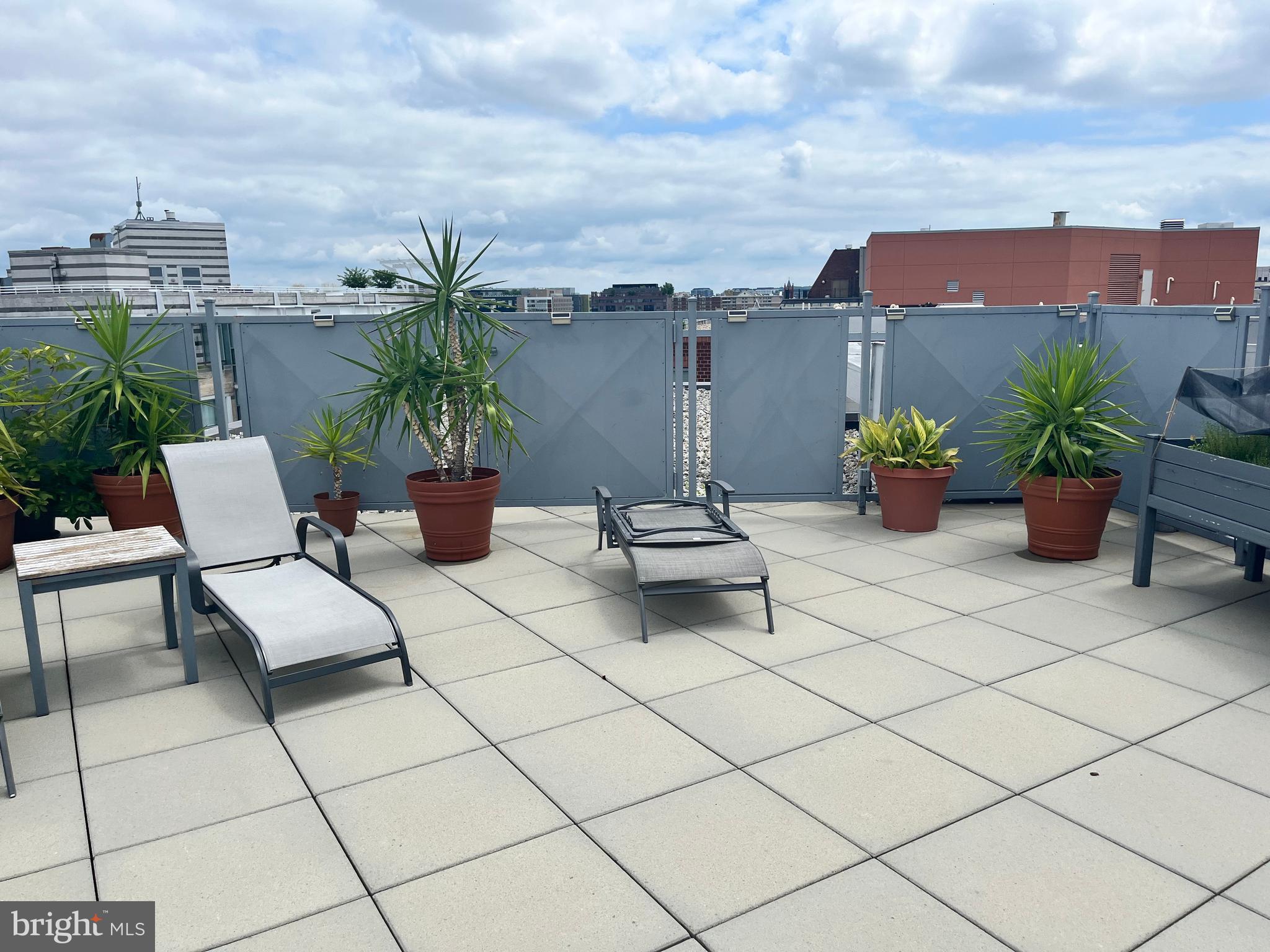 1239 Vermont Avenue Northwest, Unit 104 Washington, DC 20005 - Photo 26 of 30 a view of a terrace with furniture