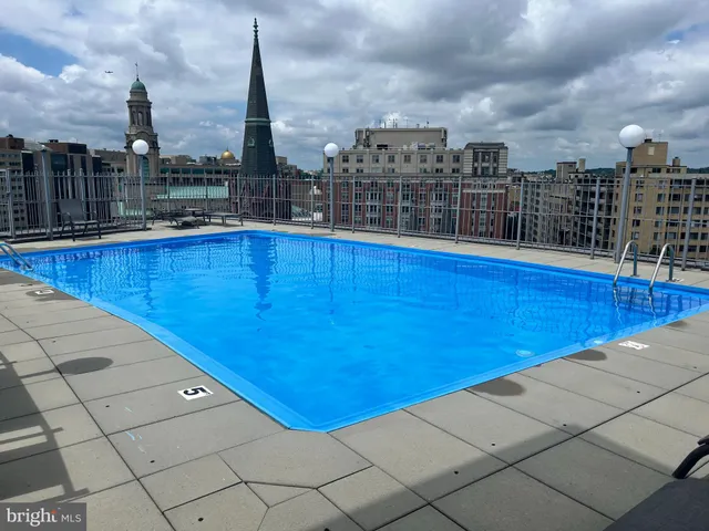 a view of roof with city view
