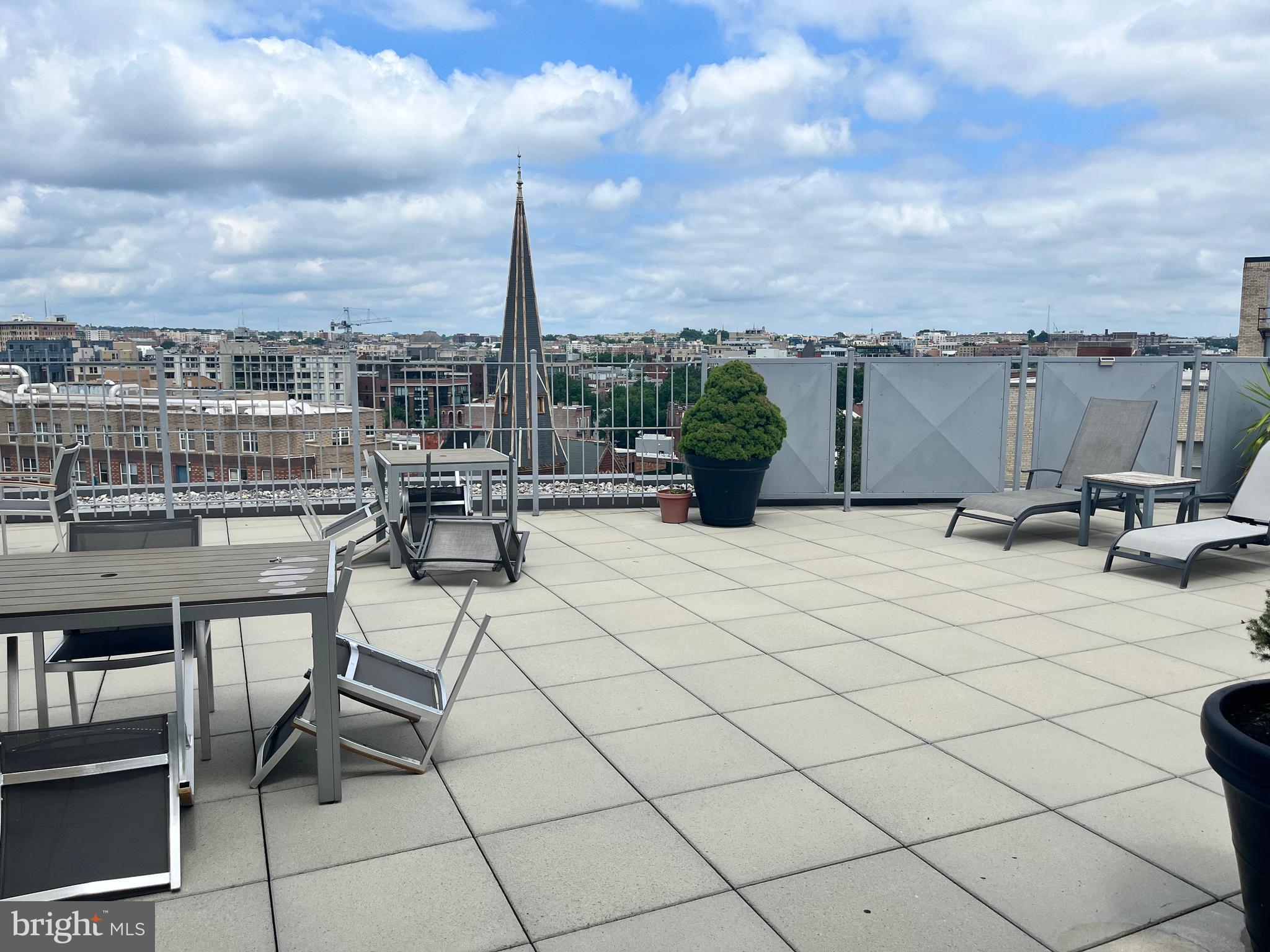 1239 Vermont Avenue Northwest, Unit 104 Washington, DC 20005 - Photo 6 of 30 a view of a terrace with furniture