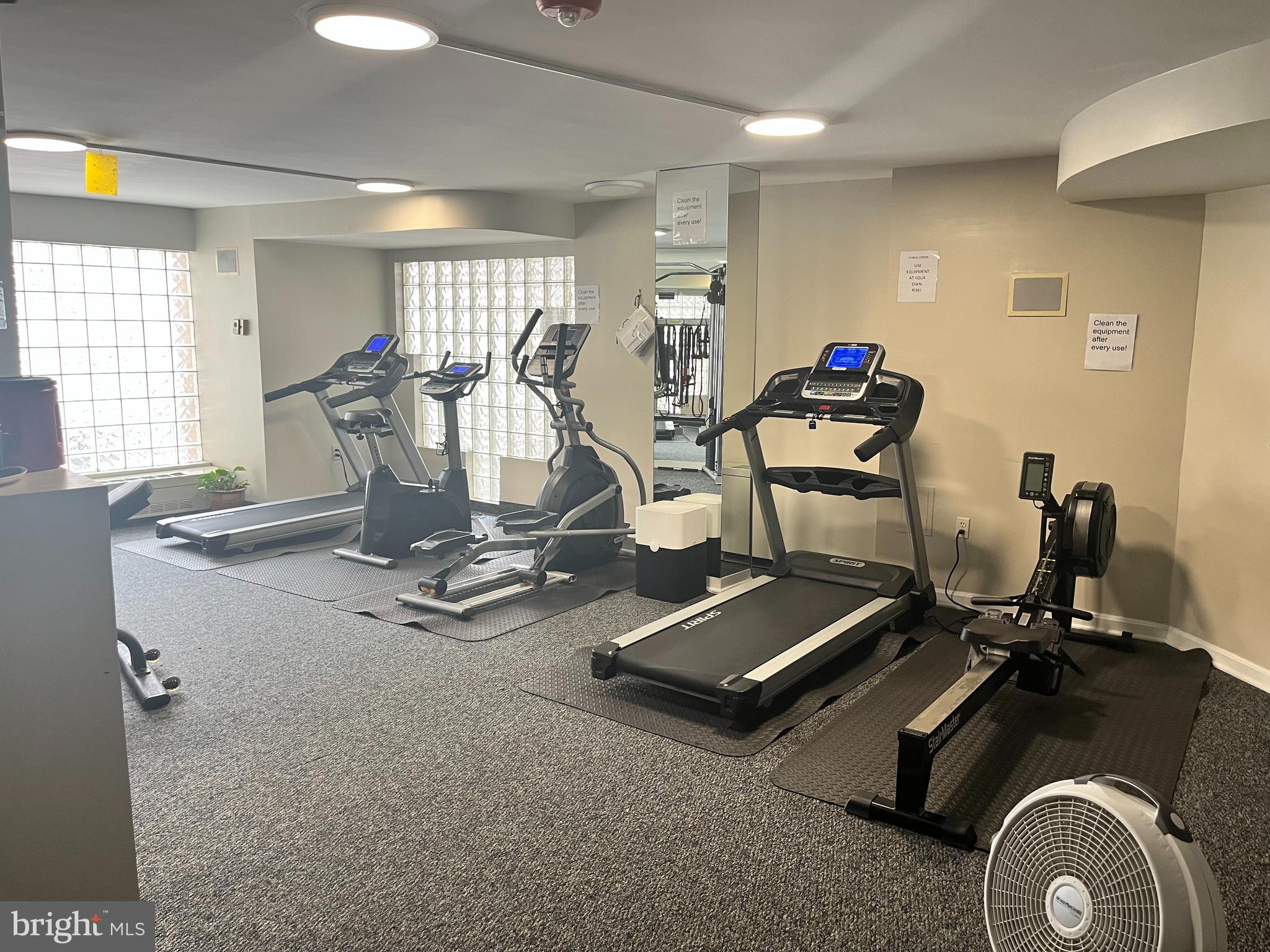 1239 Vermont Avenue Northwest, Unit 104 Washington, DC 20005 - Photo 8 of 30 a room with gym equipment and windows