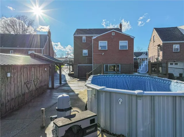 a view of a brick building next to a yard